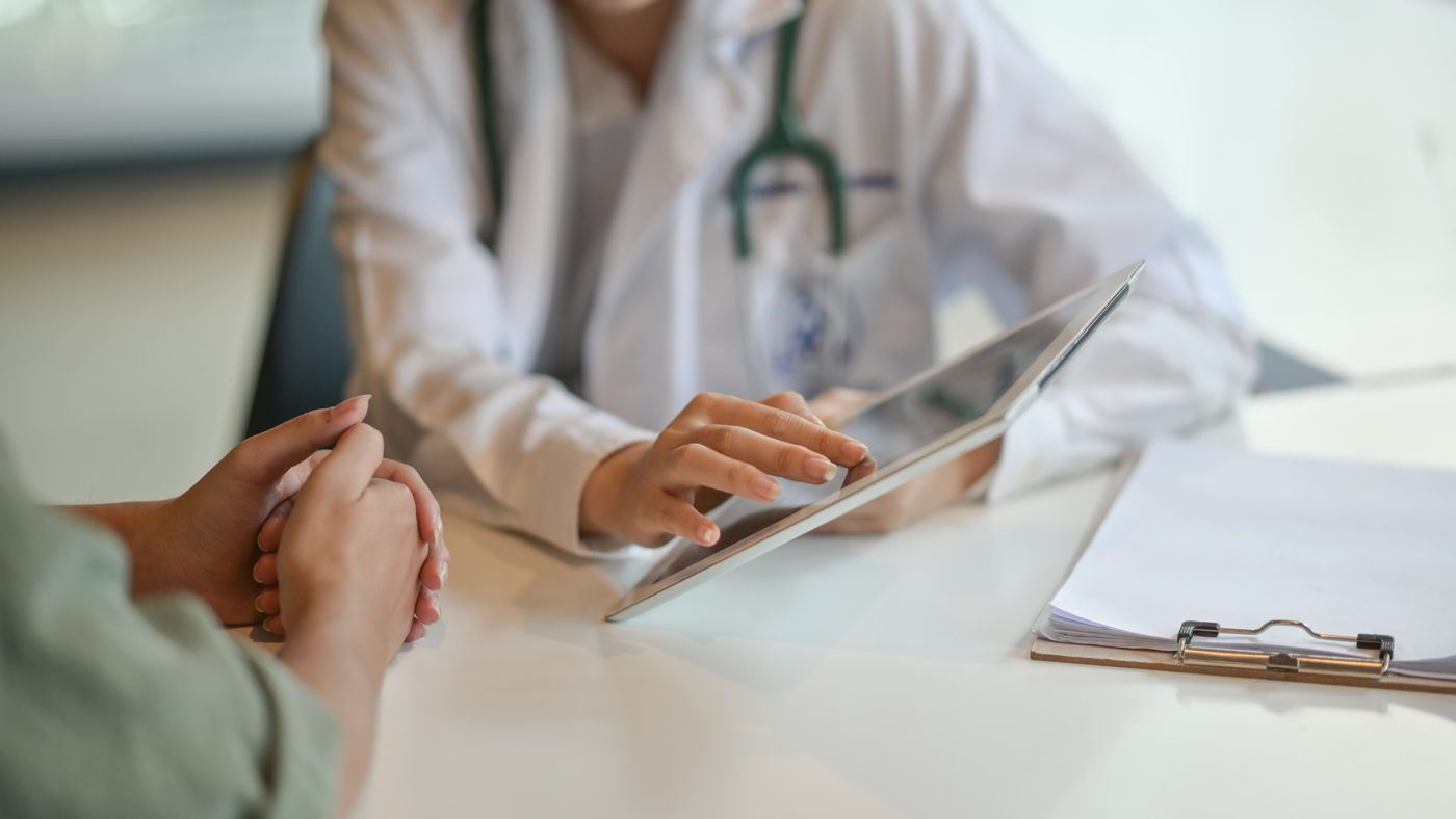A clinician reviewing results with a patient